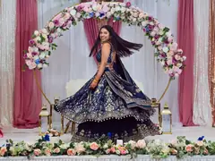 Bride twirling in a lehenga at her reception